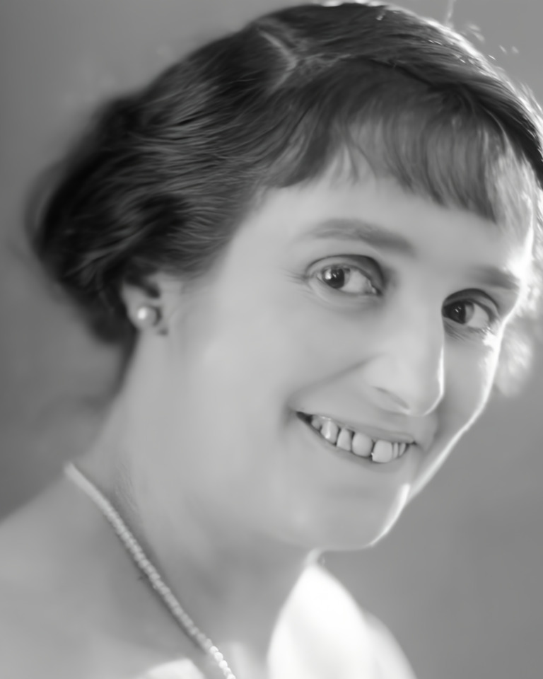 Old photo scan, after: the same black-and-white portrait, with quieter grain on the face and hair