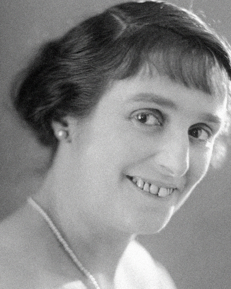 Old photo scan, before: a black-and-white studio portrait with grain, a pearl earring, and a beaded necklace
